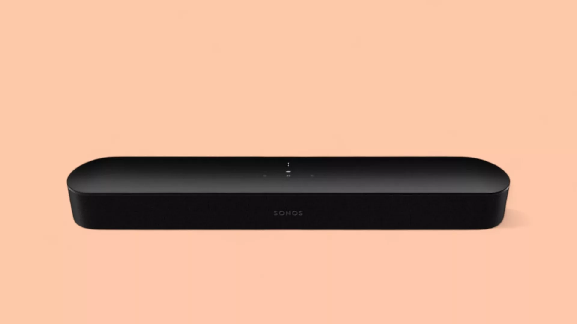 Sonos Beam Soundbar vor pfirsichfarbenem Hintergrund