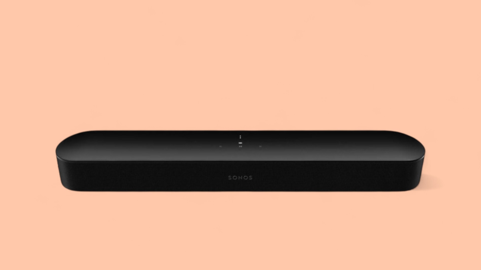 Sonos Beam Soundbar vor pfirsichfarbenem Hintergrund