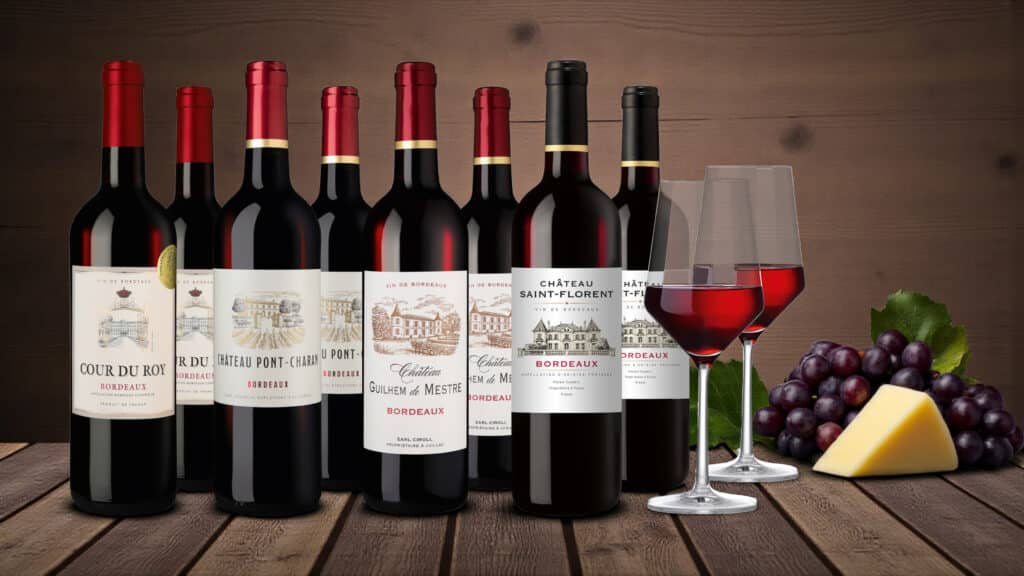 Acht Flaschen Rotwein mit Gläsern bei Hawesko im Angebot