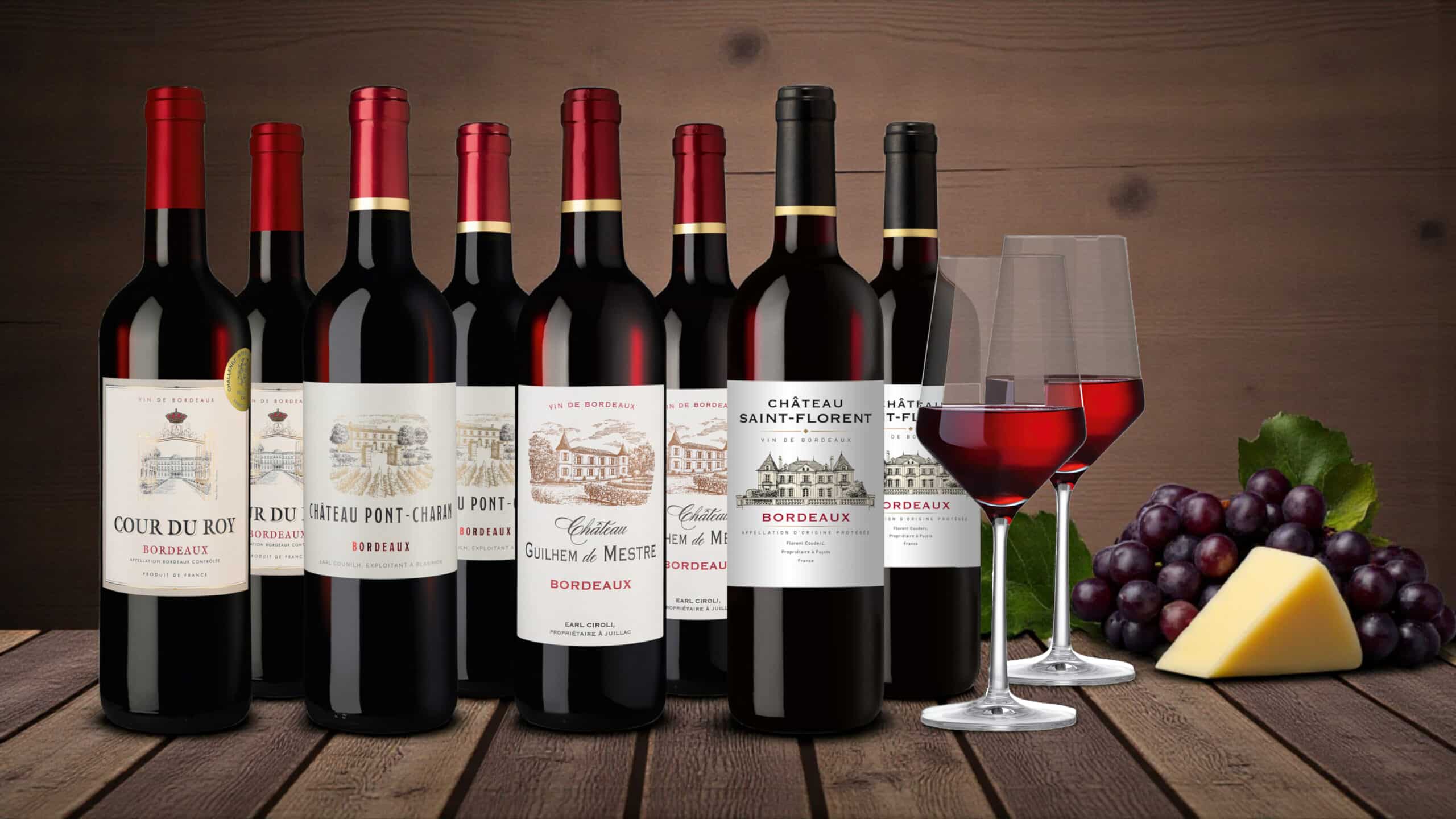 Acht Flaschen Rotwein mit Gläsern bei Hawesko im Angebot