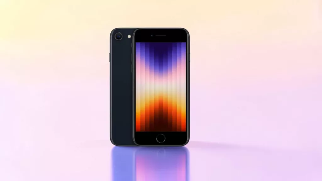 Schwarzes Apple iPhone SE von hinten und vorne mit buntem Bildschirm vor hellrosa und gelben Hintergrund mit Spiegelung unten