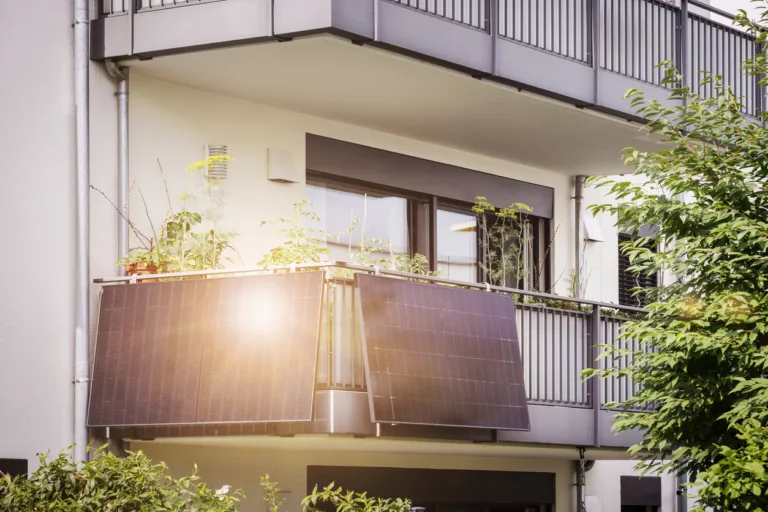 Balcony Solar Panels of Apartment Building. Mini Solar Installation Ecoflow on Balcony. Modern BALCONY SOLAR SYSTEM with Sun Reflection.