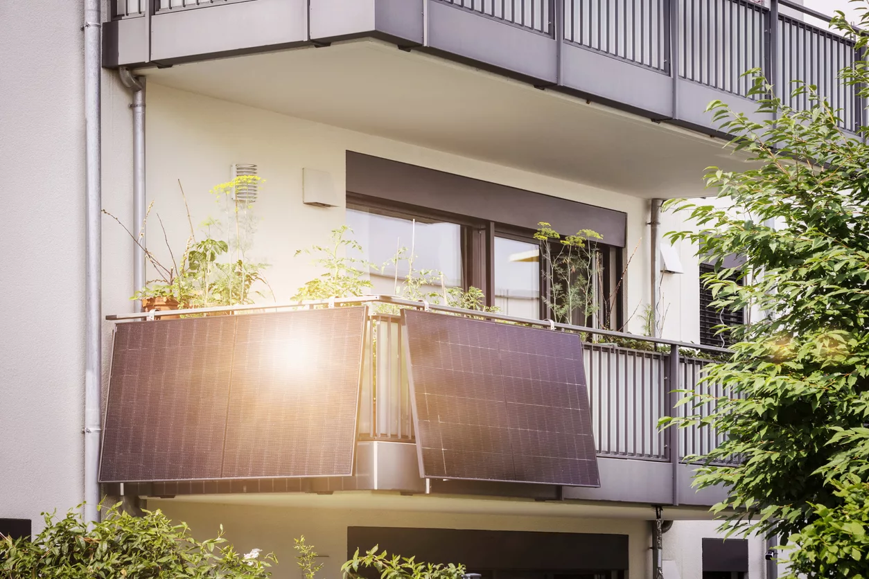 Balcony Solar Panels of Apartment Building. Mini Solar Installation Ecoflow on Balcony. Modern BALCONY SOLAR SYSTEM with Sun Reflection.